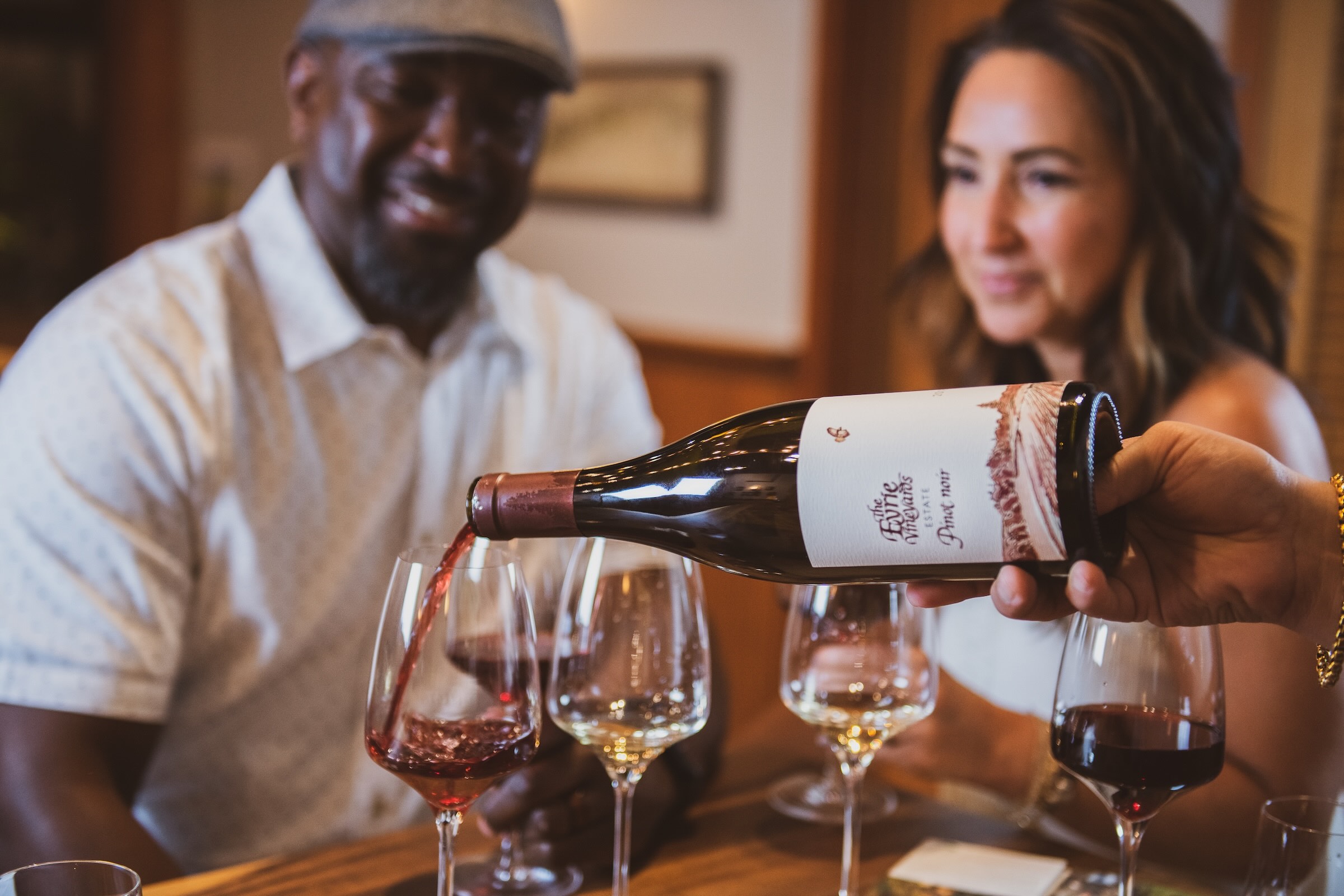 Tasters enjoying a beautiful pour of Pinot noir